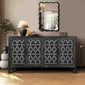 Buffet antique noir à quatre portes en bois ajouré avec détails floraux